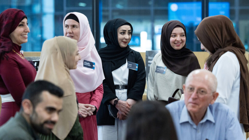 A group of women socialising at the Iftar Dinner 2025